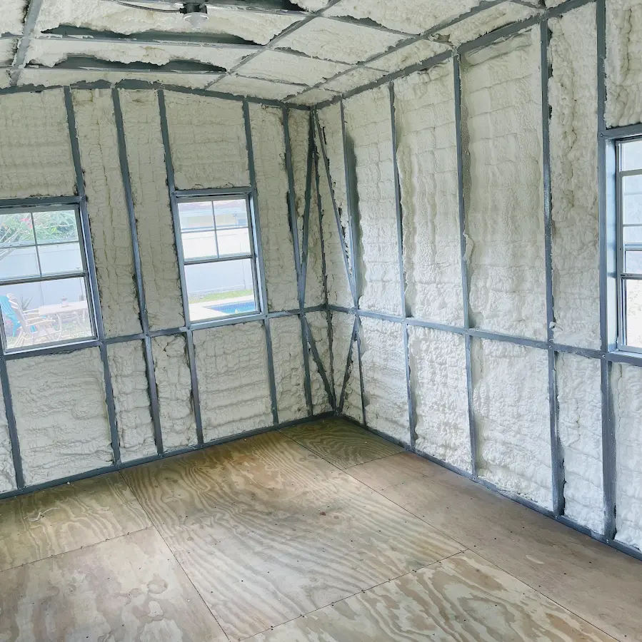 Closed-cell spray foam insulation applied to wall cavities in a residential project in Absecon